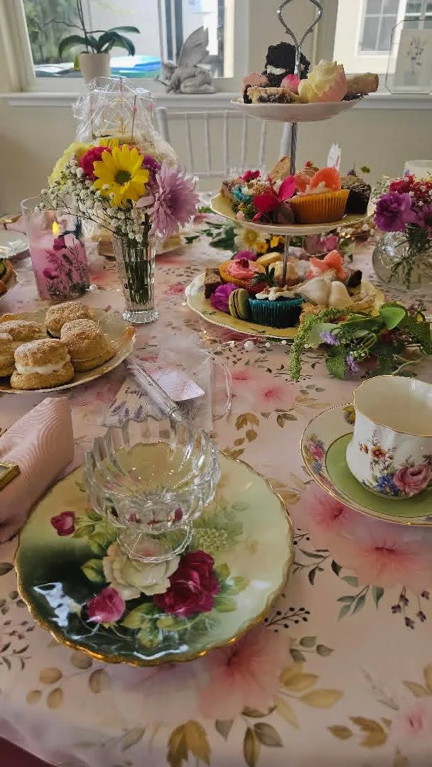 An individual tea-party place setting with china and flowers